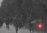 Image of American soldiers walking through Querceta Italy Querceta Italy, 1945, second 29 stock footage video 65675080794