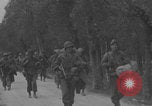 Image of American soldiers walking through Querceta Italy Querceta Italy, 1945, second 30 stock footage video 65675080794