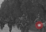 Image of American soldiers walking through Querceta Italy Querceta Italy, 1945, second 31 stock footage video 65675080794