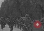Image of American soldiers walking through Querceta Italy Querceta Italy, 1945, second 32 stock footage video 65675080794