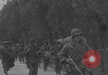 Image of American soldiers walking through Querceta Italy Querceta Italy, 1945, second 33 stock footage video 65675080794