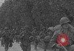Image of American soldiers walking through Querceta Italy Querceta Italy, 1945, second 34 stock footage video 65675080794