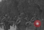 Image of American soldiers walking through Querceta Italy Querceta Italy, 1945, second 36 stock footage video 65675080794