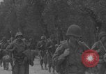Image of American soldiers walking through Querceta Italy Querceta Italy, 1945, second 37 stock footage video 65675080794