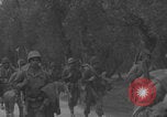 Image of American soldiers walking through Querceta Italy Querceta Italy, 1945, second 38 stock footage video 65675080794