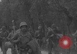 Image of American soldiers walking through Querceta Italy Querceta Italy, 1945, second 39 stock footage video 65675080794