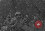Image of American soldiers walking through Querceta Italy Querceta Italy, 1945, second 40 stock footage video 65675080794