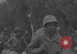 Image of American soldiers walking through Querceta Italy Querceta Italy, 1945, second 41 stock footage video 65675080794