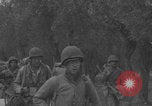Image of American soldiers walking through Querceta Italy Querceta Italy, 1945, second 43 stock footage video 65675080794