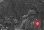Image of American soldiers walking through Querceta Italy Querceta Italy, 1945, second 45 stock footage video 65675080794