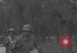 Image of American soldiers walking through Querceta Italy Querceta Italy, 1945, second 49 stock footage video 65675080794