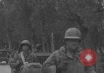 Image of American soldiers walking through Querceta Italy Querceta Italy, 1945, second 50 stock footage video 65675080794