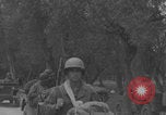 Image of American soldiers walking through Querceta Italy Querceta Italy, 1945, second 51 stock footage video 65675080794