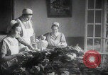 Image of Red Cross workers gift packing Germany, 1944, second 1 stock footage video 65675080821