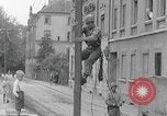 Image of US soldier climbing Delitzsch Saxony Germany, 1945, second 25 stock footage video 65675080838