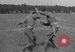 Image of practicing disarming opponent with knife United States USA, 1938, second 38 stock footage video 65675080899