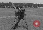 Image of practicing disarming opponent with knife United States USA, 1938, second 54 stock footage video 65675080899