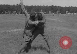 Image of practicing disarming opponent with knife United States USA, 1938, second 55 stock footage video 65675080899