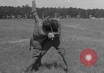 Image of practicing disarming opponent with knife United States USA, 1938, second 56 stock footage video 65675080899