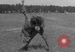 Image of practicing disarming opponent with knife United States USA, 1938, second 57 stock footage video 65675080899