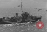 Image of casualties evacuated from landing craft Normandy France, 1944, second 56 stock footage video 65675080939