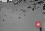 Image of Army ski troops descend mountain slopes Washington State United States USA, 1941, second 5 stock footage video 65675080943