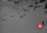 Image of Army ski troops descend mountain slopes Washington State United States USA, 1941, second 8 stock footage video 65675080943