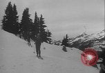 Image of Army ski troops descend mountain slopes Washington State United States USA, 1941, second 21 stock footage video 65675080943