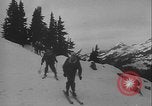 Image of Army ski troops descend mountain slopes Washington State United States USA, 1941, second 25 stock footage video 65675080943