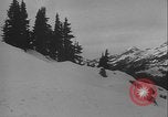 Image of Army ski troops descend mountain slopes Washington State United States USA, 1941, second 34 stock footage video 65675080943
