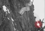 Image of US Army rappelling exercise Washington State United States USA, 1941, second 44 stock footage video 65675080946