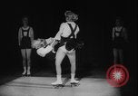 Image of roller skating acrobatics performance Germany, 1940, second 11 stock footage video 65675080993